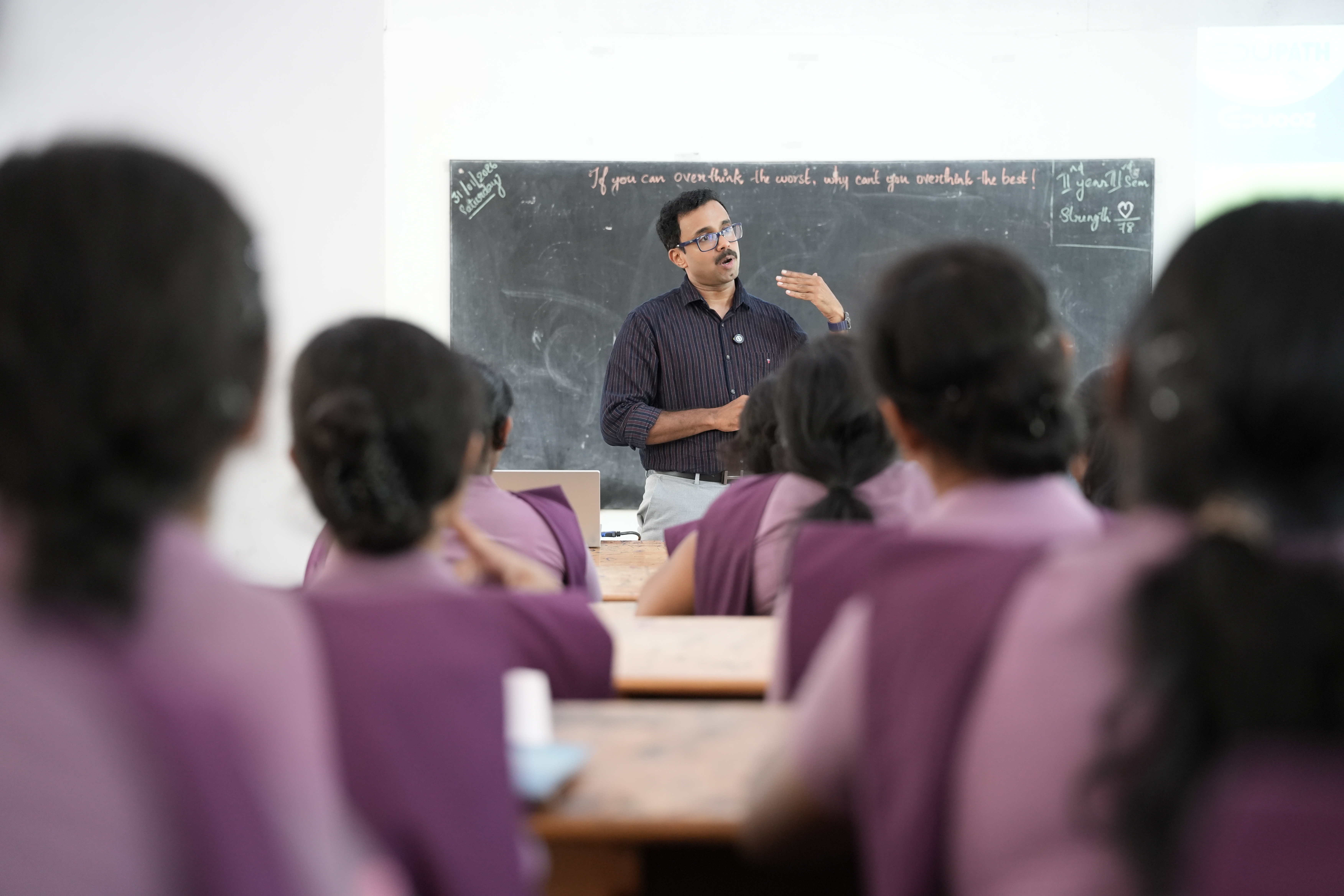Group of students listening to a faculty talk during orientation