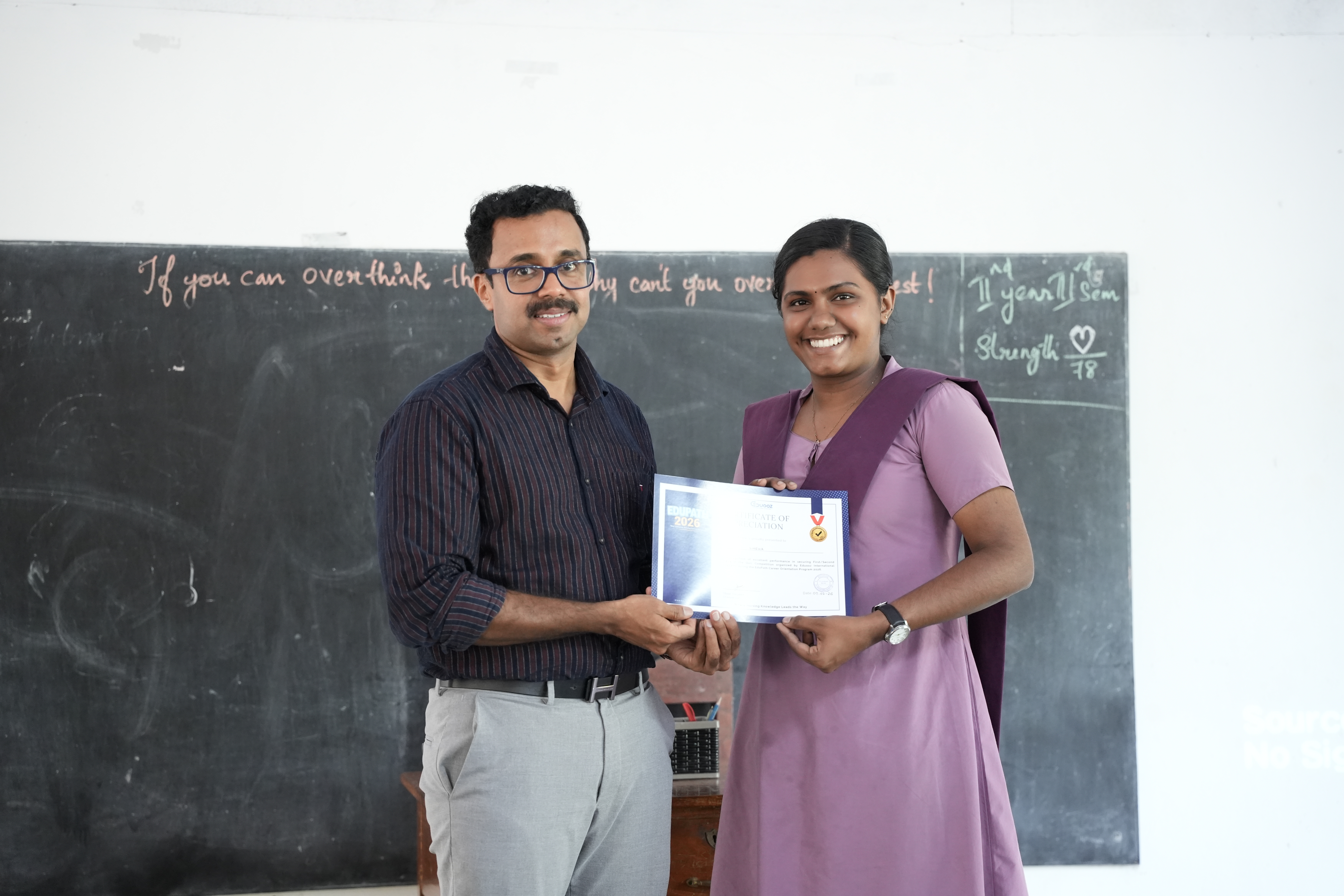 Mentor explaining course material using a laptop presentation