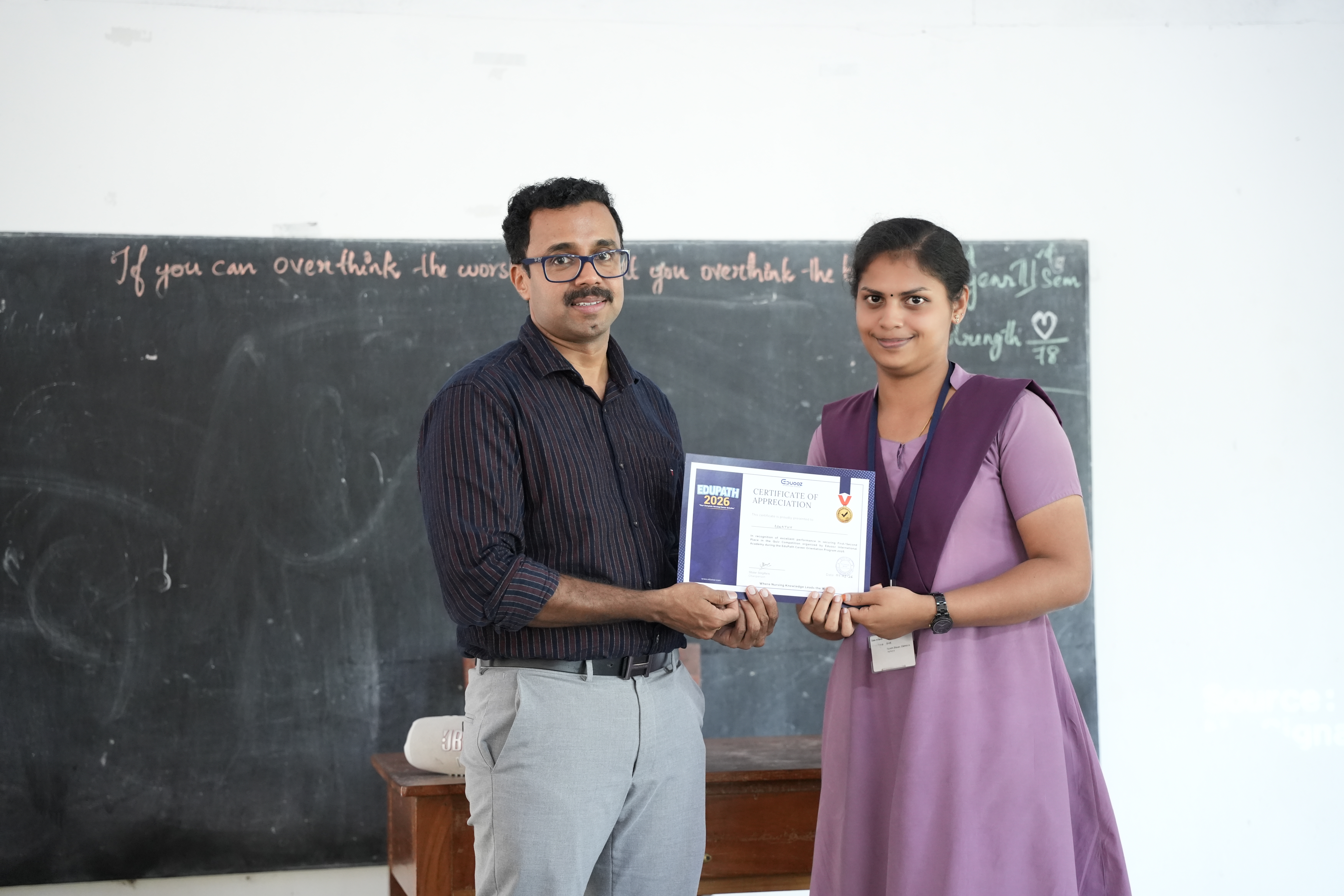 Faculty member walking through the classroom while teaching