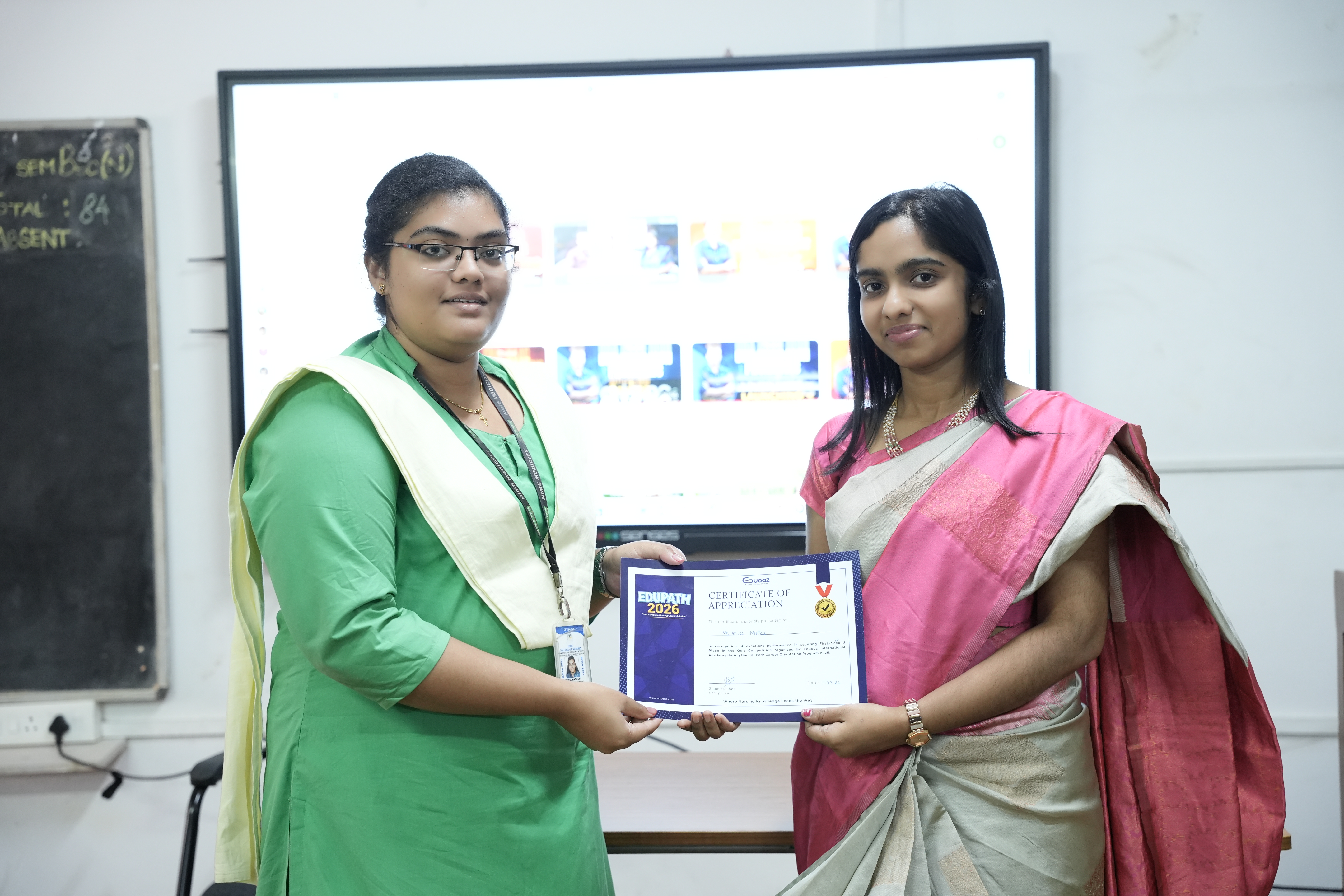 Student proudly displaying a certificate of appreciation